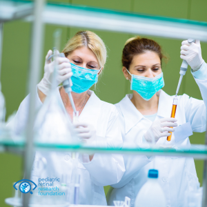 Two female scientists working in a lab with test tubes